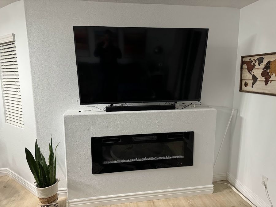 Custom fireplace & TV wall - after